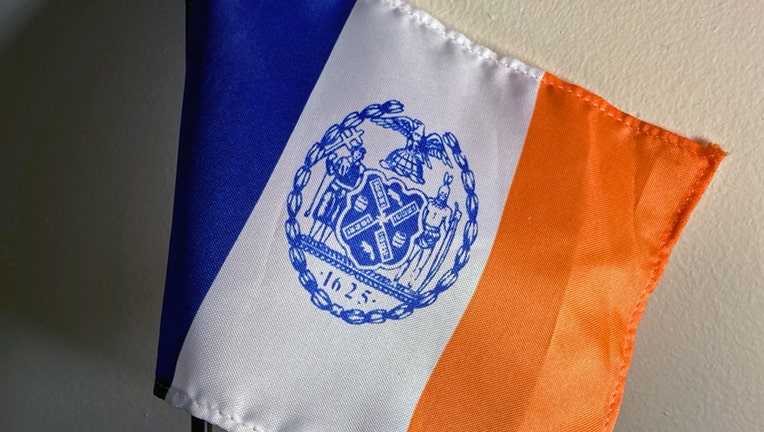 Blue, white and orange flag of New York City which displays the city's seal