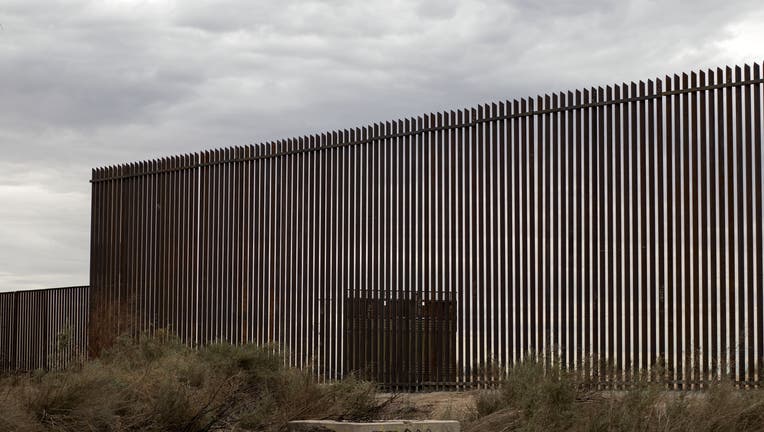 c8710b44-View of a section of the new border fence between Mexico and the US in Mexicali, Baja California state, Mexico on March 10, 2018. President Trump is expected to inspect the border wall prototypes during his visit to California on March 13. / AFP PHOTO / Guillermo Arias (Photo credit should read GUILLERMO ARIAS/AFP via Getty Images)