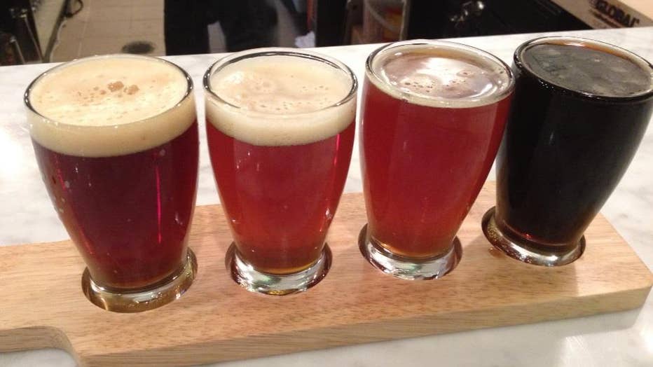 A flight of 4 glasses of beer