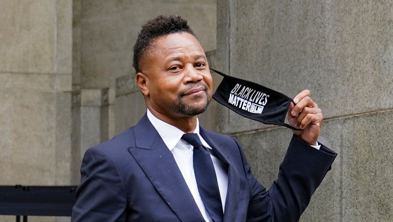 Cuba Gooding Jr. showing a face mask that reads Black Lives Matter