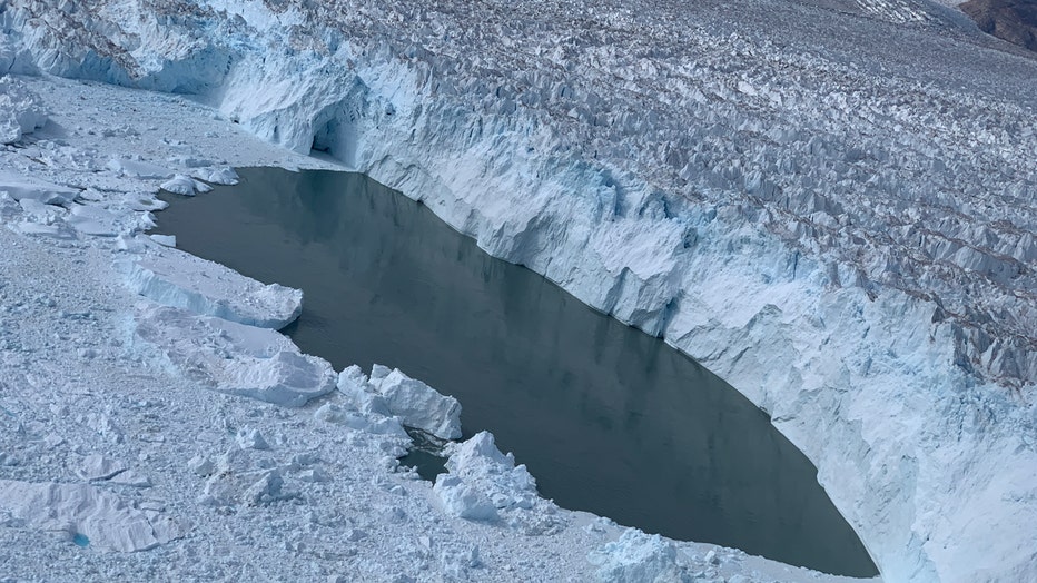 Aerial image of a glacier and water