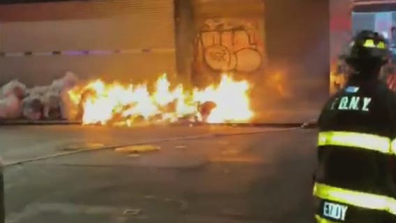 Suspect charged with setting fire to trash piles in Manhattan