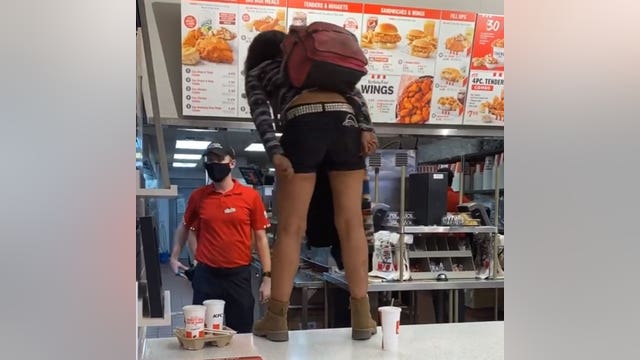 Maskless woman at KFC hops on counter, demands service