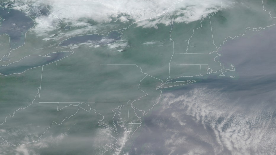 Satellite image showing cloud and smoke formations over Northeast United States