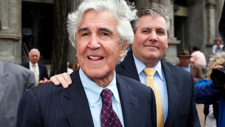 Former state Senator Joseph Bruno, left, and his son Ken Bruno walk away from the federal courthouse after a jury found him not guilty of federal fraud charges on Friday, May 16, 2014, in Albany, N.Y.