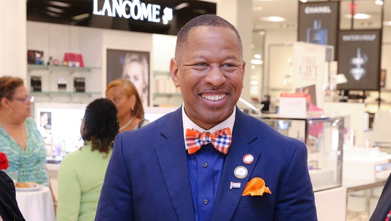 Andy Kind in a blue suit and red, white and blue bowtie