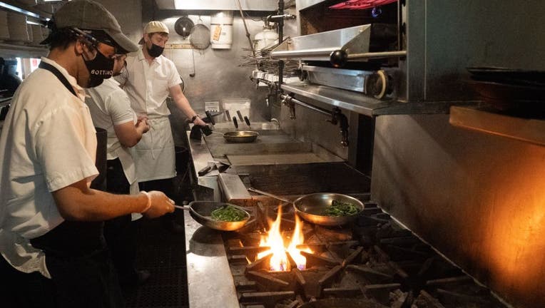 Chefs work at Bottino Restaurant in Chelsea as NYC restaurants open for limited capacity indoor dining.