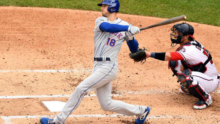 Ryan Cordell #18 of the New York Mets takes a swing during a baseball game against the Washington Nationals at Nationals Park on September 27, 2020 in Washington, DC.