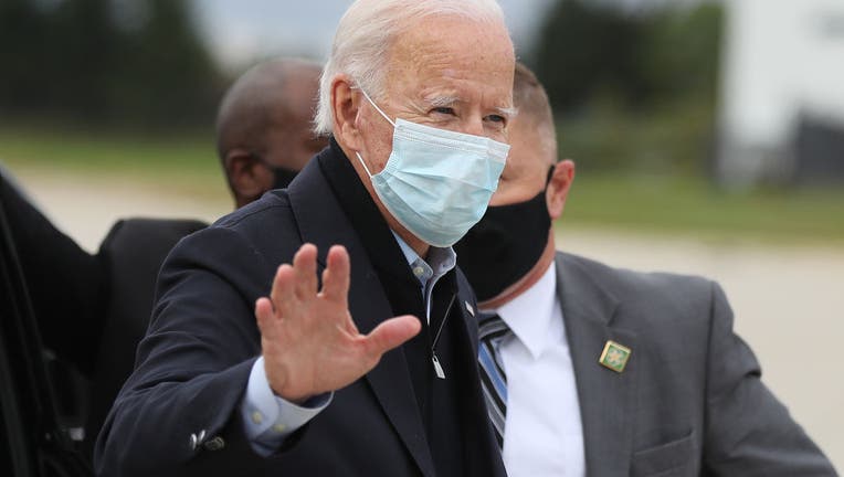 Joe Biden waves while campaigning in Michigan.