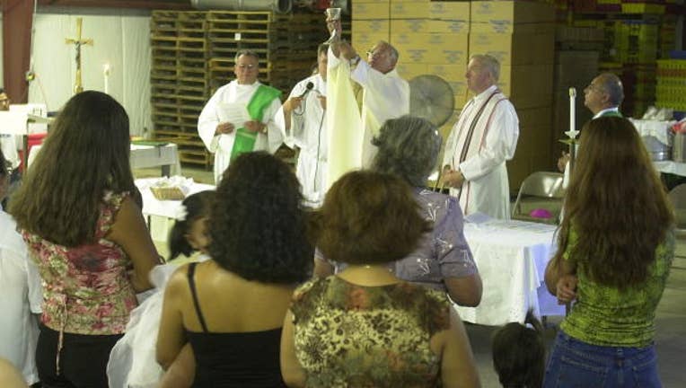 FILE -Catholic Mass in Hammonton, New Jersey.