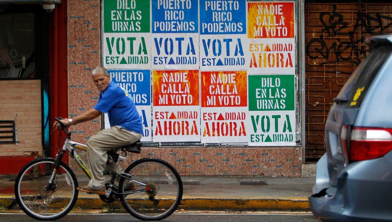 A wall covered with campaign posters in Puerto Rico