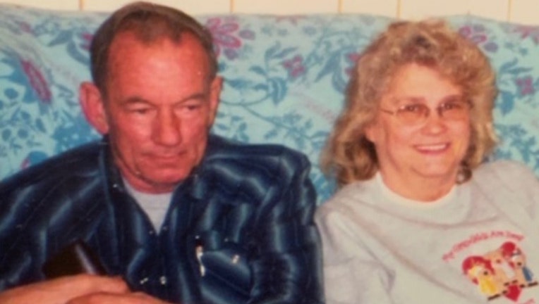 Man and woman sitting on a couch