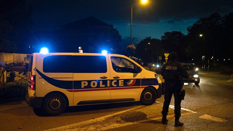 French police officers stand guard a street in Eragny on October 16, 2020, where an attacker was shot dead by policemen after he decapitated a man earlier on the same day. (Photo by ABDULMONAM EASSA/AFP via Getty Images)