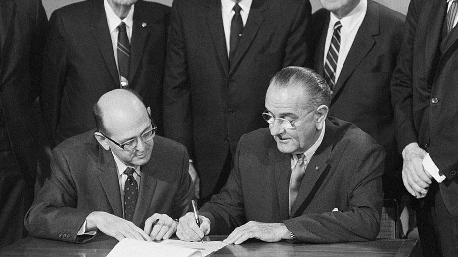 President Johnson Signing Amendment