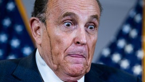 Hair dye runs down Rudy Giuliani's face during news conference
