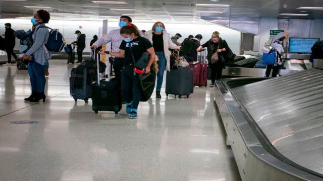 Many Americans flying for holiday despite CDC pleas