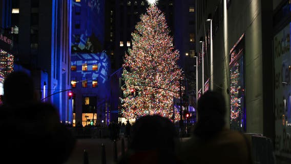 Rockefeller Center Christmas Tree illuminated under pandemic rules