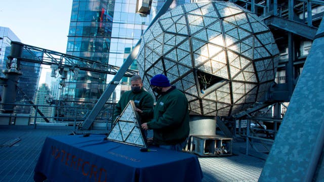Workers install 192 crystals on Times Square New Year's ball