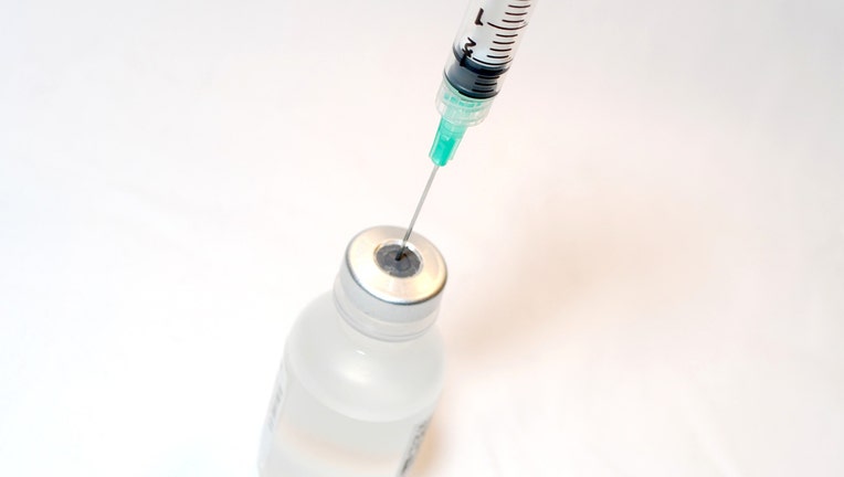 A vial and a syringe