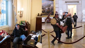 Chaos: Pro-Trump rioters make selves at home inside Capitol, sitting behind desks, making off with podiums