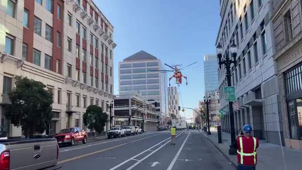Helicopter drops huge A/C unit onto Oakland street