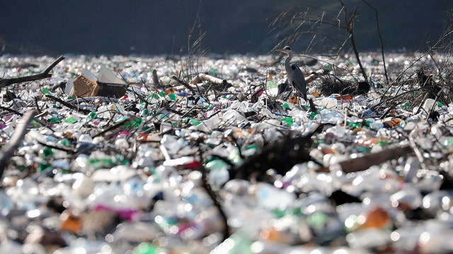 Islands of garbage clog rivers, threaten dam in the Balkans