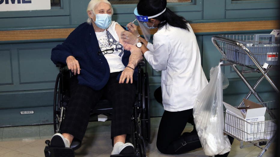 Rhoda Winkelman, a resident at the New Jewish Home in Manhattan, receives the Pfizer-BioNTech COVID-19 vaccine on December 21, 2020 in New York City.