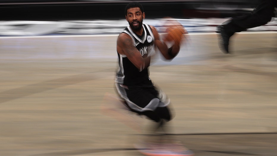 Kyrie Irving of the Brooklyn Nets dribbles