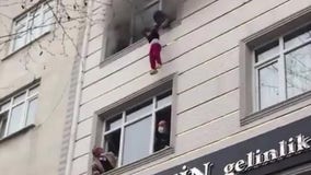 Children plunge from 4th floor of burning building