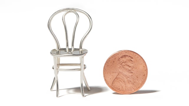 Tiny silver charm sold in a vending machine benefits Chef José Andrés food charity