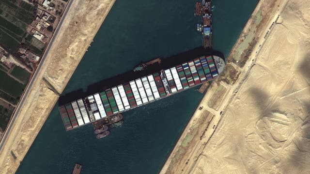 Tugboats deployed to help cargo ship stuck in Suez Canal