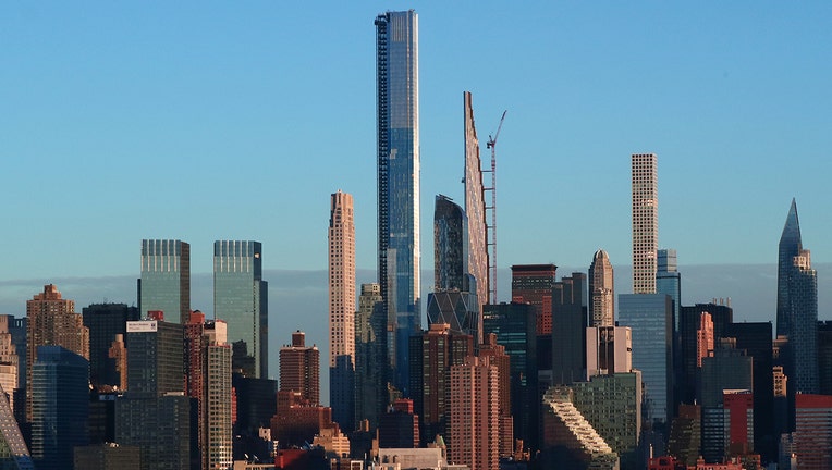 Central Park Tower rises above 220 Central Park South, One 57, the Steinway Tower and 432 Park Avenue along Billionaires' Row as the sun sets in New York City on December 7, 2020 as seen from Weehawken, New Jersey. (Photo by Gary Hershorn/Getty Images)