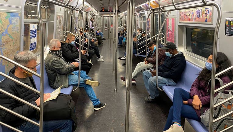 Commuters ride the New York City Subway