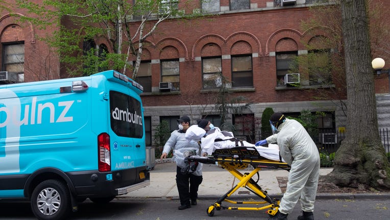 NEW YORK CITY, UNITED STATES - 2020/04/17: Ambulance workers pickup an elderly man from Cobble Hill Health Center, the nursing home that recently registered an alarming amount of covid-19 deaths.