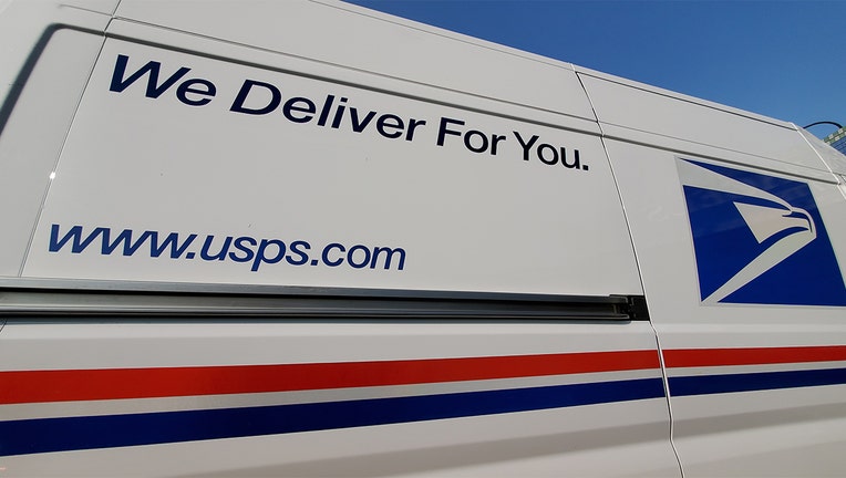 Wide angle view of logo on United States Postal Service (USPS) truck, Lafayette, California, September 17, 2020.