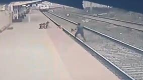 Railway employee in India rescues child who fell on tracks from oncoming train