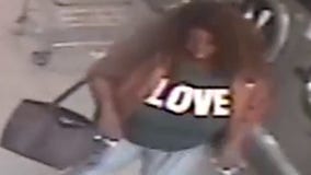 Woman wearing LOVE shirt attacks laundromat worker with bottle of detergent