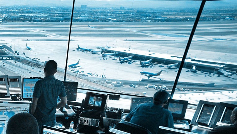 Interior of an airport tower with a view out the windows onto the airport