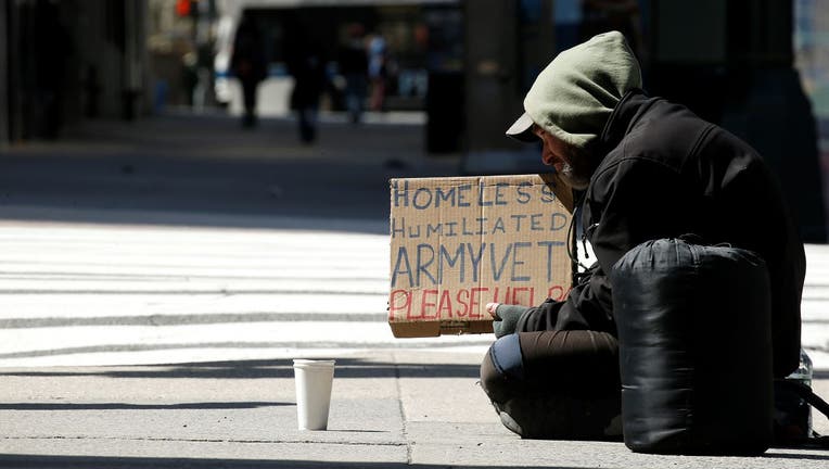 A homeless man begs for money on 42ne Street amid the coronavirus pandemic on April 11, 2020.