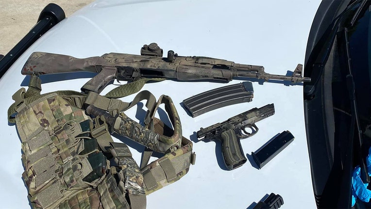 A photo released by Crowley Police shows the weapons found in the car.