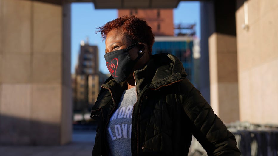 Carla Brown, executive director of the Charles A. Walburg Multi-Service Organization, waits for the arrival of vans that will make meals-on-wheels deliveries in upper Manhattan, New York, Wednesday, March 3, 2021.