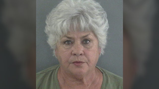 Police: Woman threw burger, racial slurs at fast food worker