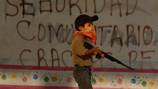 Mexican villages arm children in desperate bid