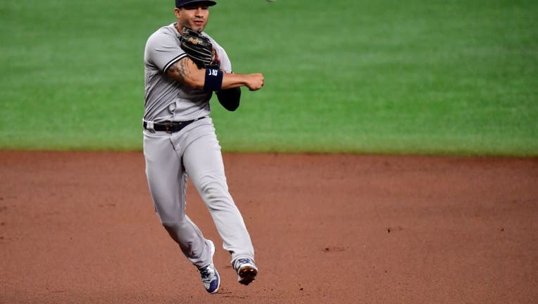 Gleyber Torres #25 of the New York Yankees fields a ball