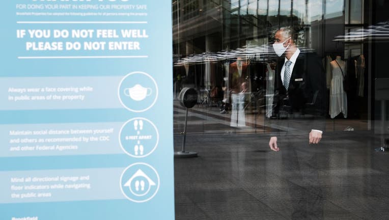 A man wears a face masks inside of a shopping mall in Manhattan