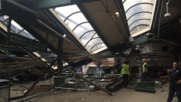 A NJ Transit train seen through the wreckage.