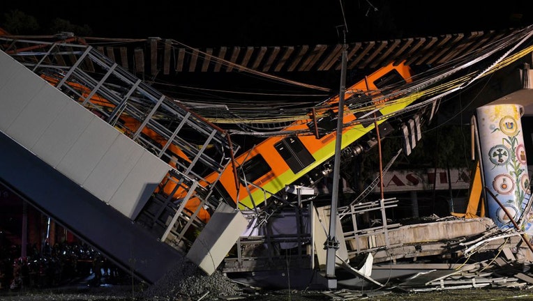 A general view shows the site of a train accident after an elevated metro line collapsed in Mexico City on May 4, 2021.