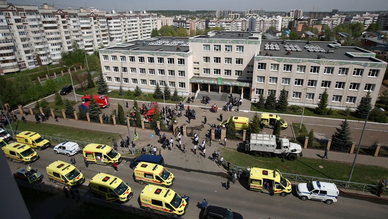 KAZAN, RUSSIA MAY 11, 2021: Ambulances and police cars at school No 175 where two attackers opened fire; at least one teacher and eight students are reported dead.