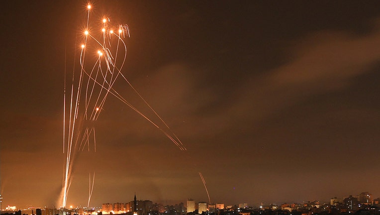 Rockets light up the night sky as they are fired towards Israel from Beit Lahia in the northern Gaza Strip on May 14, 2021.(Photo by MOHAMMED ABED/AFP via Getty Images)