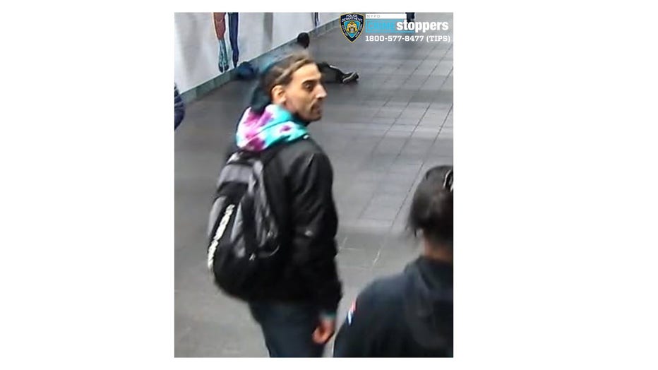 The NYPD says this man fled from the Times Square subway station after spitting on and slashing another man. 